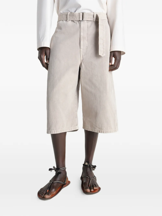 Beige wide-leg pant worn by a person, showing the pants fit