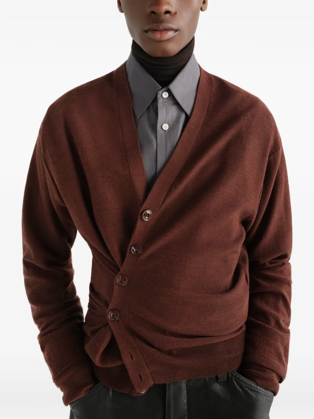 Brown knitwear worn by a person, showing the knitwear fit