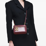 Red bag worn by a person, showing the red bag's fit