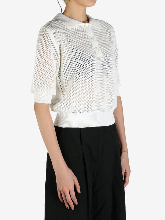 White shirt worn by a person, showing the shirt's fit