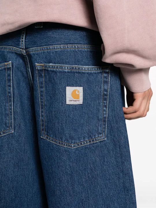 Close up of blue pants, showing texture of the cotton fabric