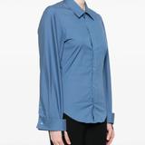 Blue shirt worn by a person, showing the shirt fit