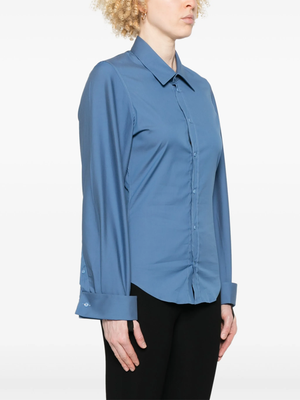 Blue shirt worn by a person, showing the shirt fit