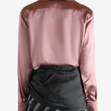 Pink shirt worn by a person, showing the shirt's fit