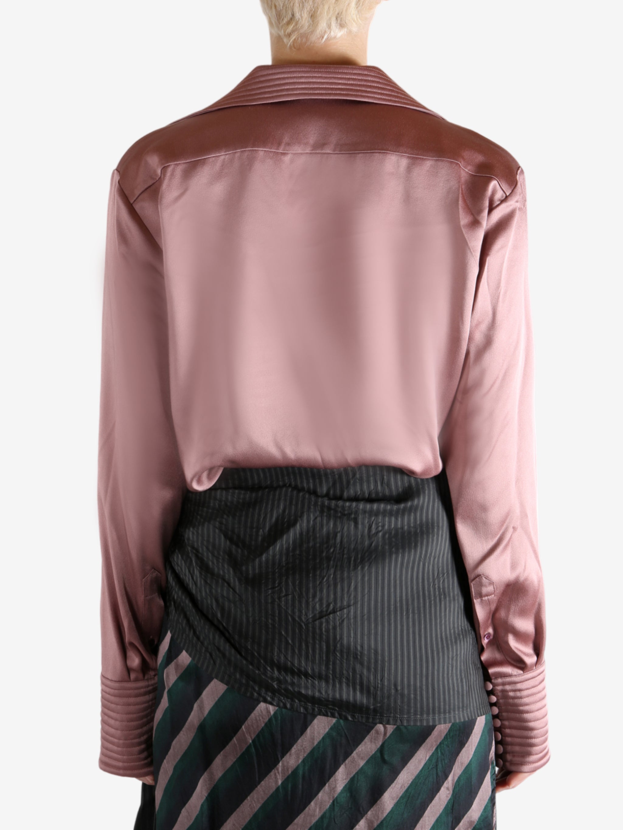 Pink shirt worn by a person, showing the shirt's fit