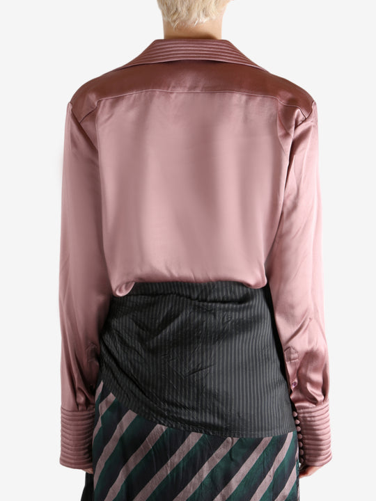 Pink shirt worn by a person, showing the shirt's fit