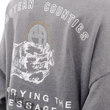Close up of grey hoodie, showing texture of the cotton fabric