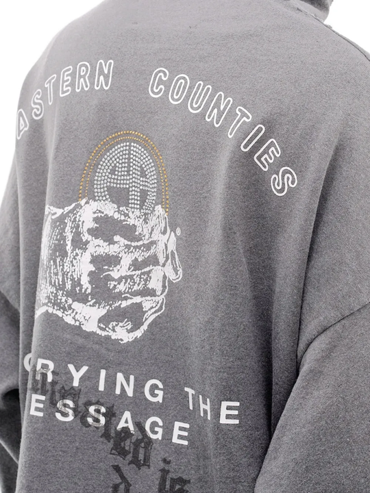 Close up of grey hoodie, showing texture of the cotton fabric