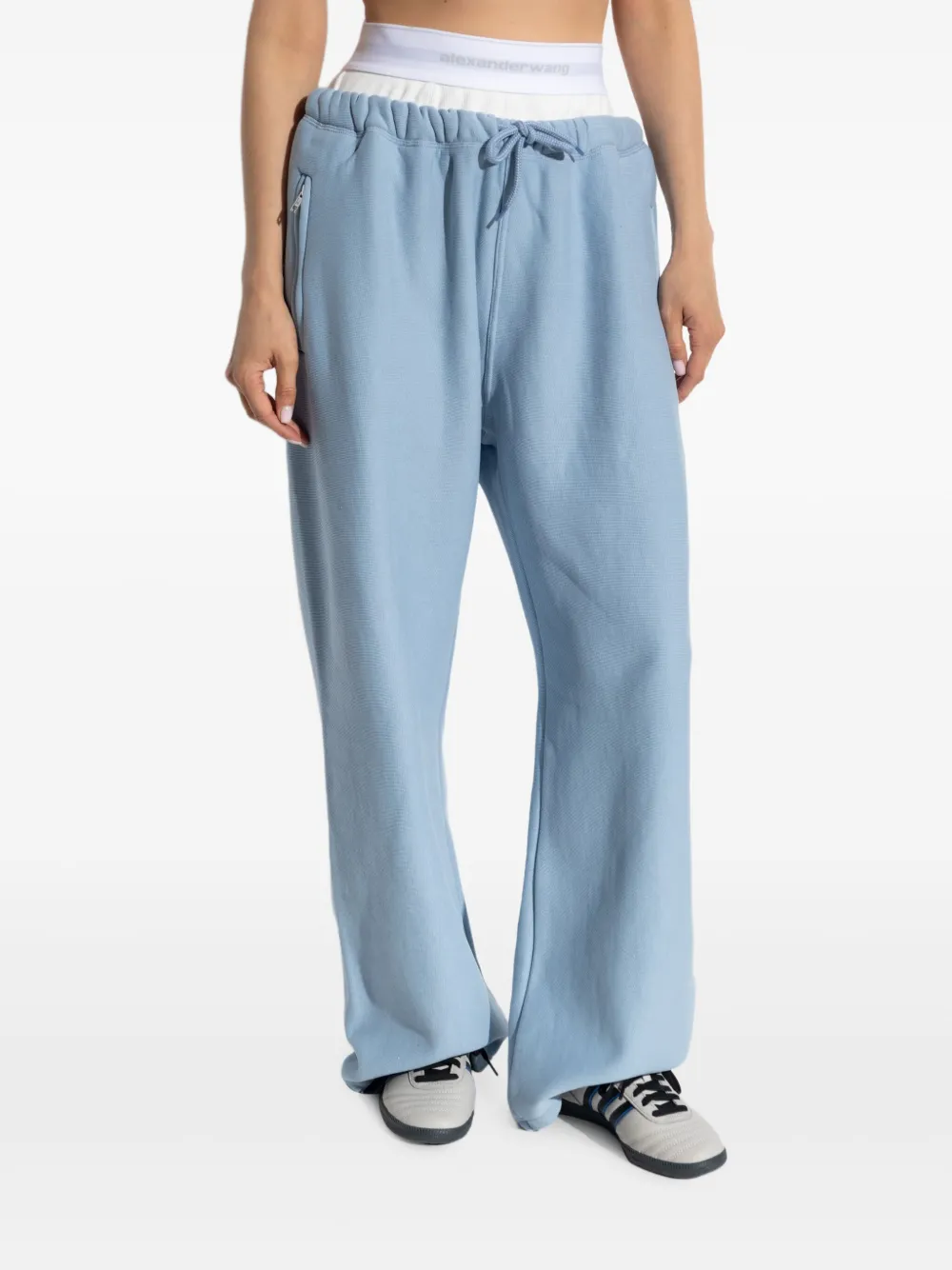 Blue pants worn by a person, showing the pants' fit