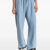 Blue pants worn by a person, showing the pants' fit
