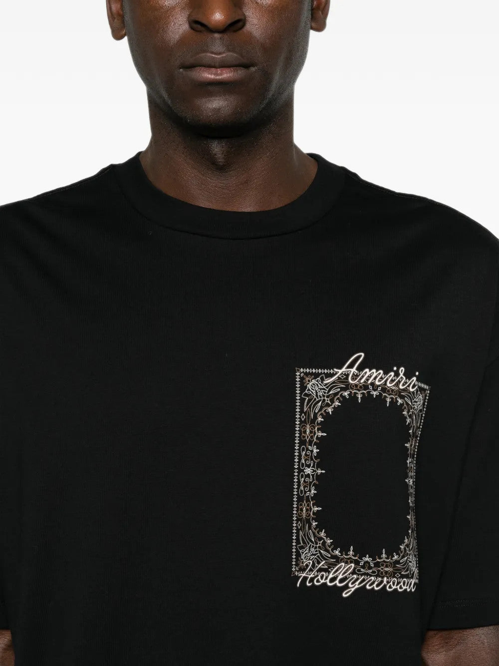 Black t-shirt worn by a person, showing the t-shirt fit