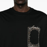 Black t-shirt worn by a person, showing the t-shirt fit