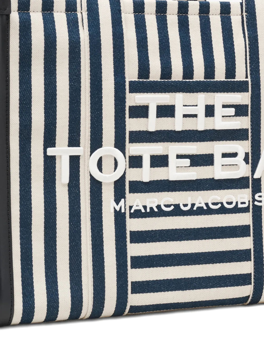 Close up of blue bag, showing texture of the cotton fabric