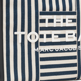 Close up of blue bag, showing texture of the cotton fabric