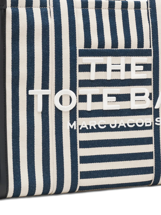 Close up of blue bag, showing texture of the cotton fabric