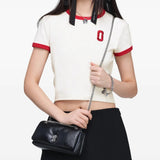 Black bag worn by a person, showing the bag fit