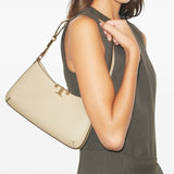 Tan bags worn by a person, showing the bags fit