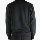 Black pullover worn by a person, showing the pullover's fit
