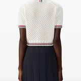 White t-shirt worn by a person, showing texture of t-shirt's fit