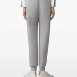 Grey pants worn by a person, showing the pants fit