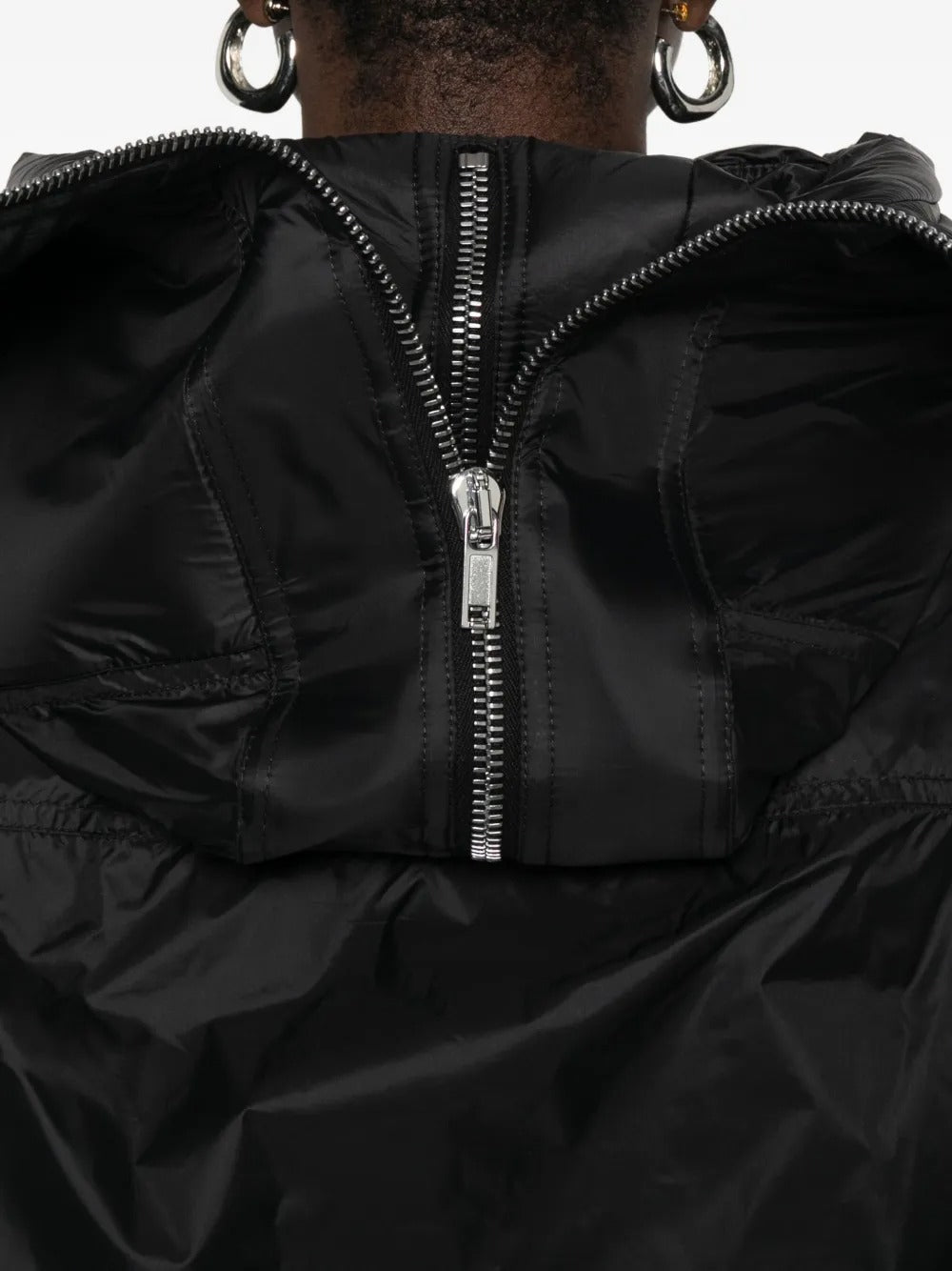 Close up of the black jacket, showing texture of the nylon fabric