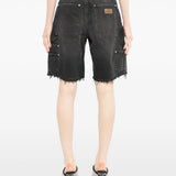 Black short worn by a person, showing the short's fit