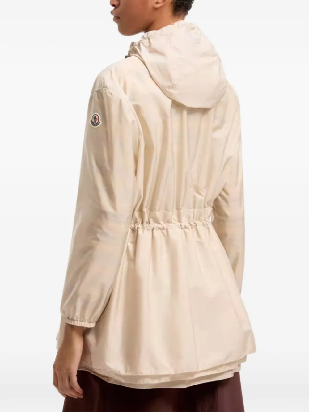 tan jackets-coat worn by a person, showing the jackets-coat's fit