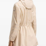 tan jackets-coat worn by a person, showing the jackets-coat's fit