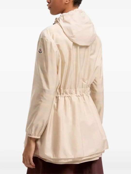 tan jackets-coat worn by a person, showing the jackets-coat's fit
