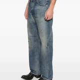 Blue jeans worn by a person, showing the jeans fit