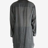 Black shirt,worn by a person, showing the shirt's fit