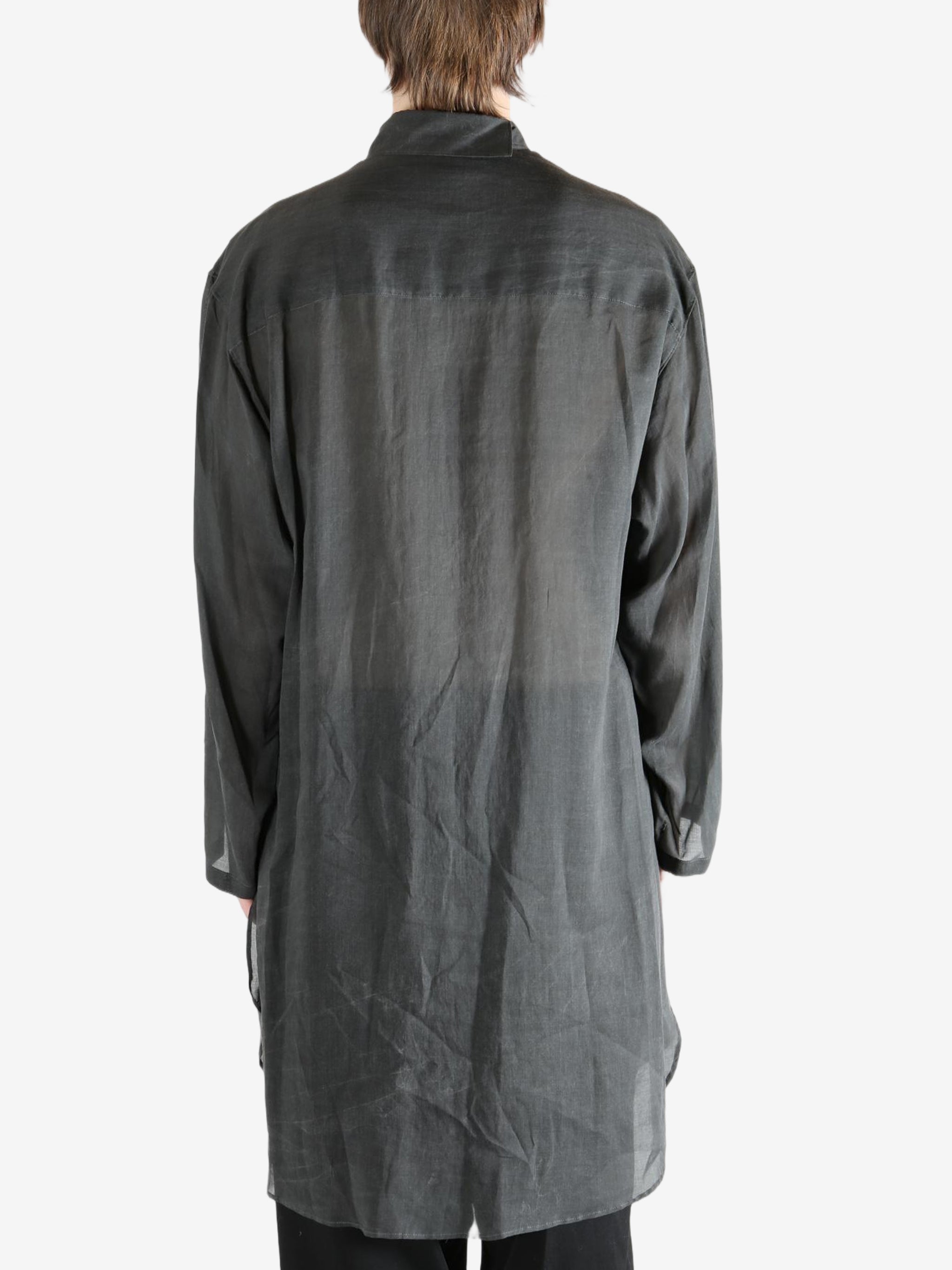 Black shirt,worn by a person, showing the shirt's fit