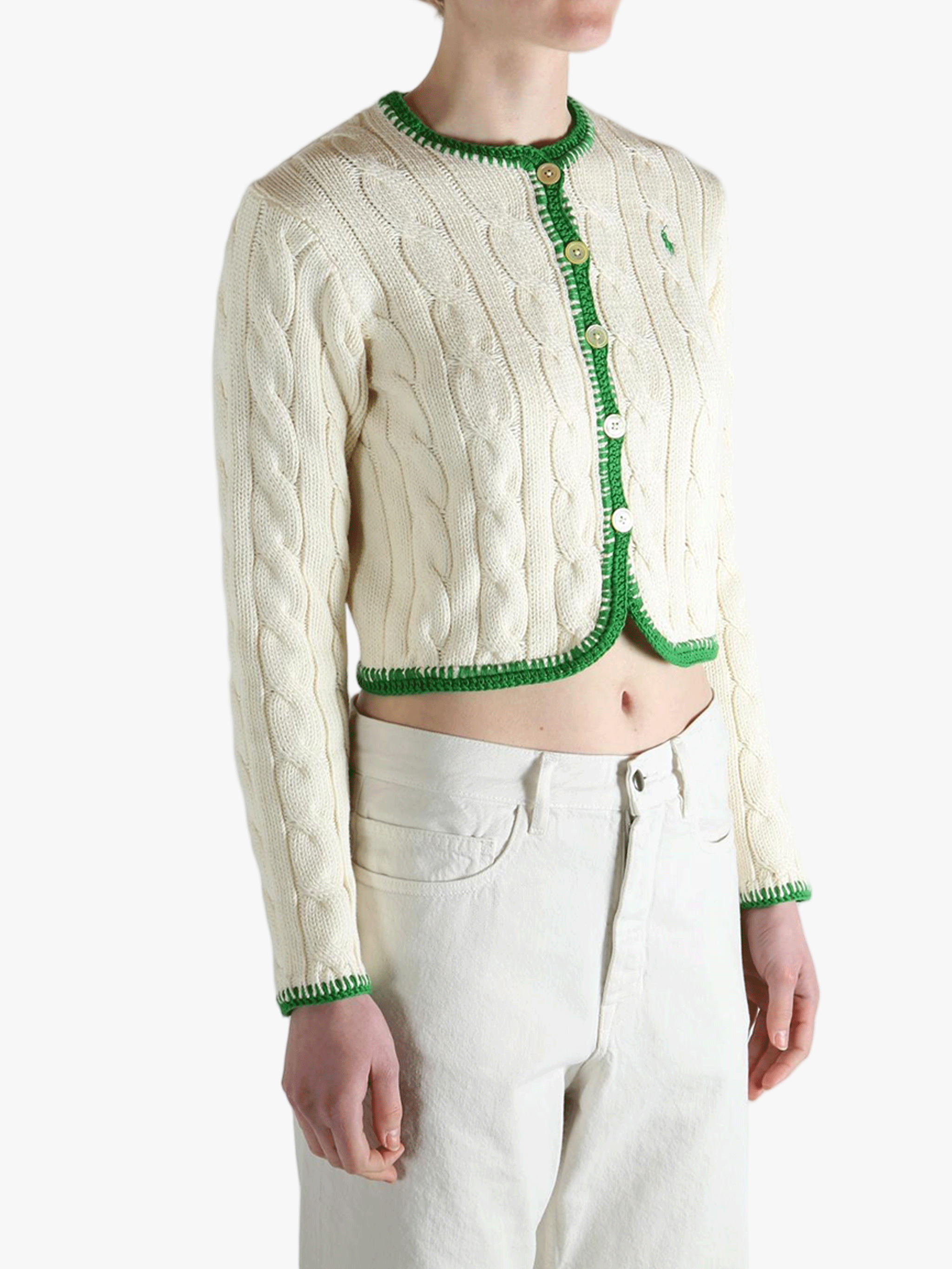 White sweater worn by a person, showing the sweater's fit