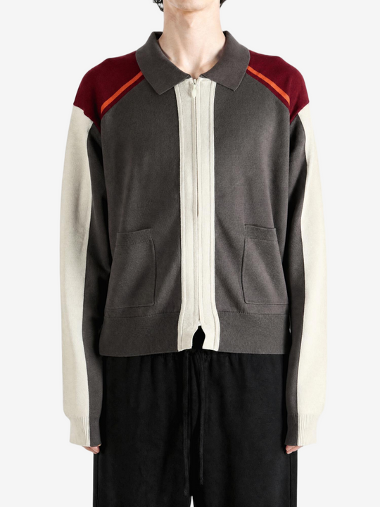 Grey knitwear worn by a person, showing the knitwear fit