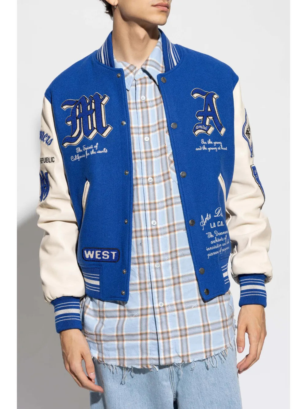 Blue jacket worn by a person, showing the jacket fit