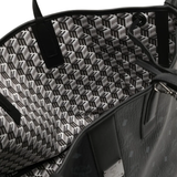 Close up of black bag, showing texture of the leather fabric