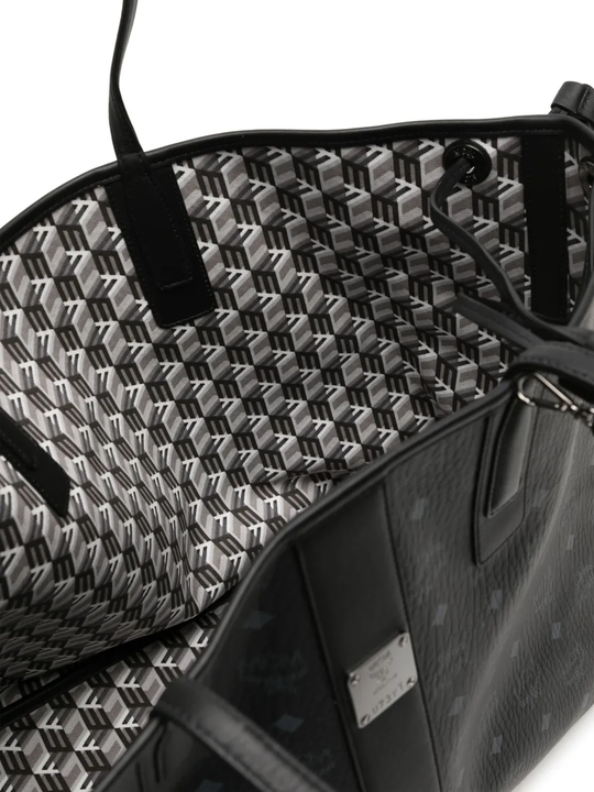 Close up of black bag, showing texture of the leather fabric