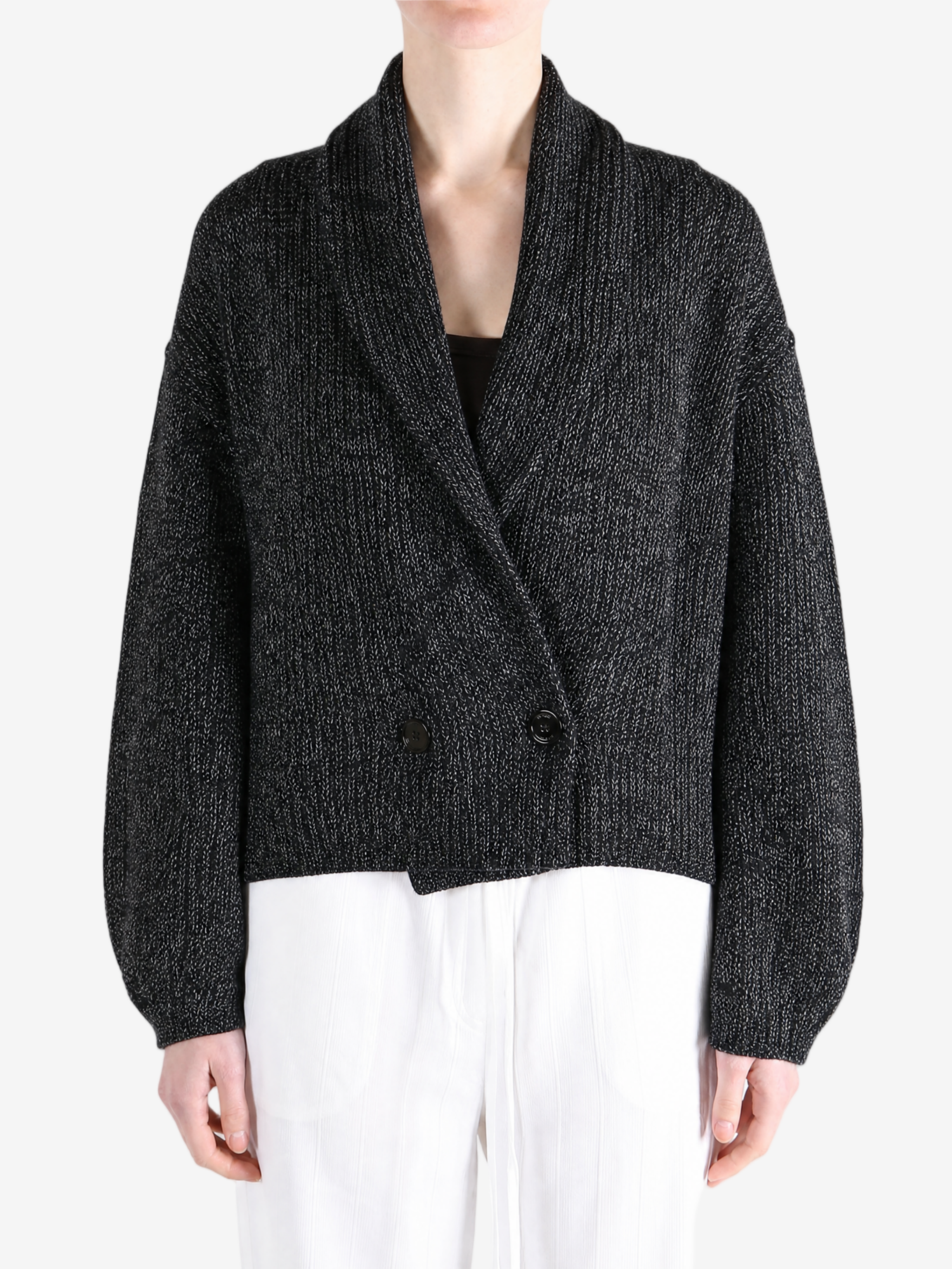 Black knitwear worn by a person, showing the knitwear fit