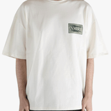 White t-shirt worn by a person, showing the t-shirt's fit