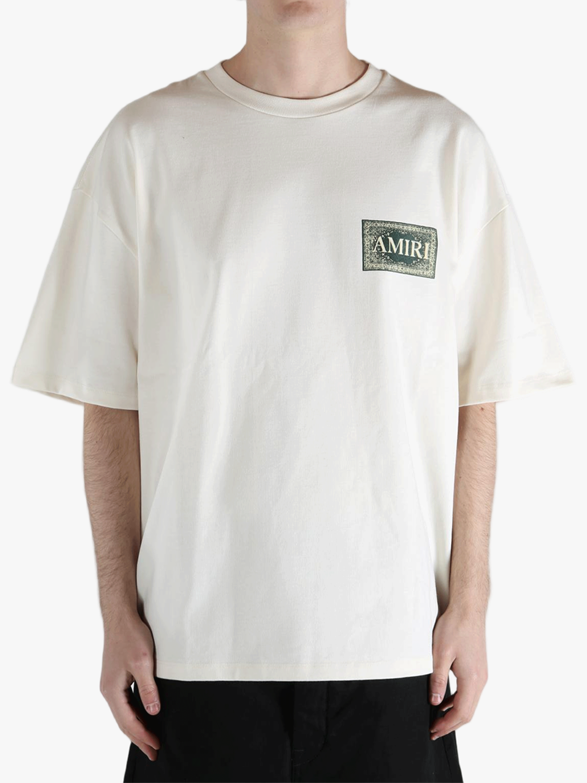 White t-shirt worn by a person, showing the t-shirt's fit