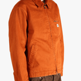 Orange jacket worn by a person, showing the jacket fit