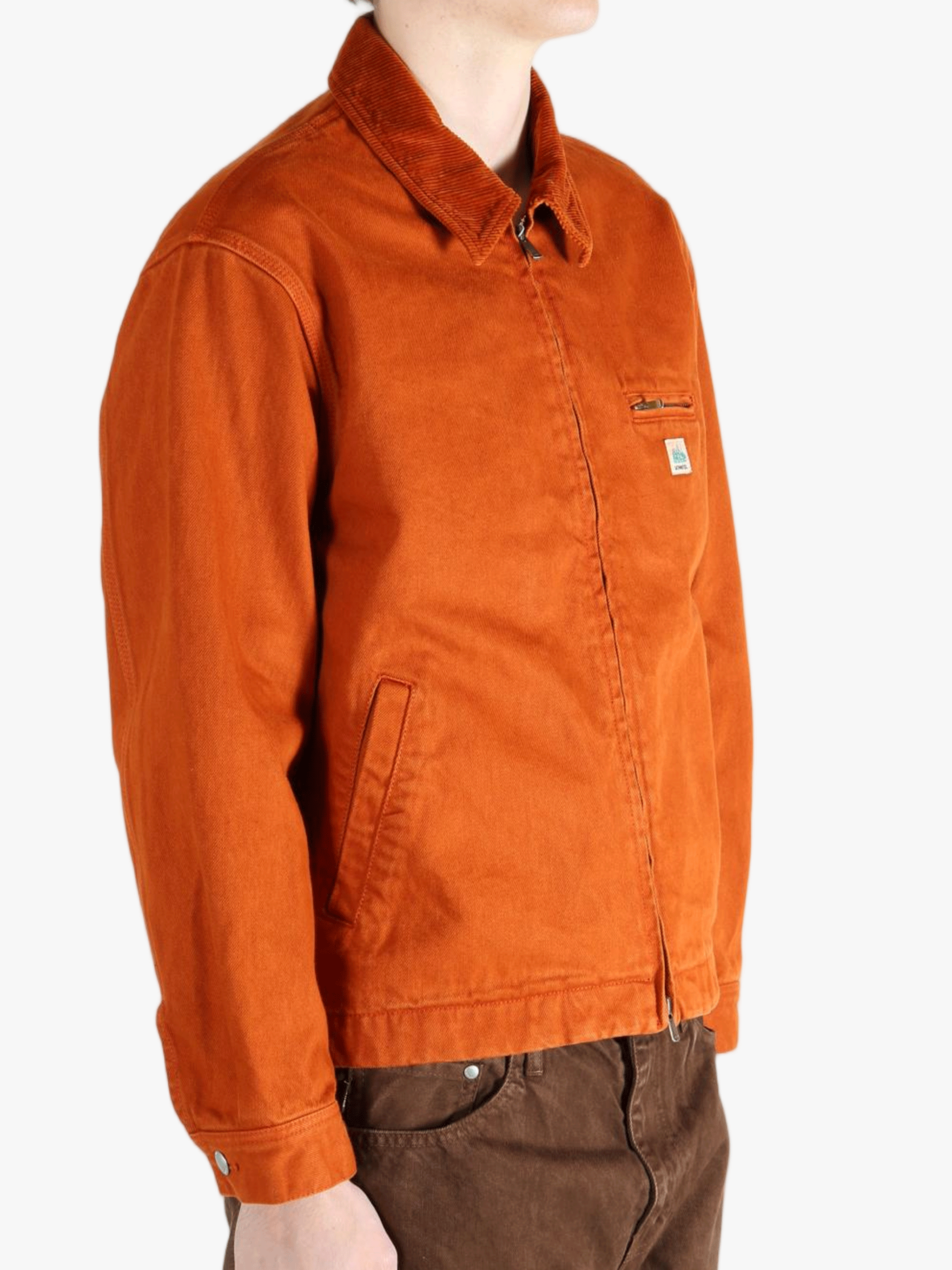 Orange jacket worn by a person, showing the jacket fit