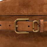 Close up of brown bags, showing texture of the suede cow leather fabric