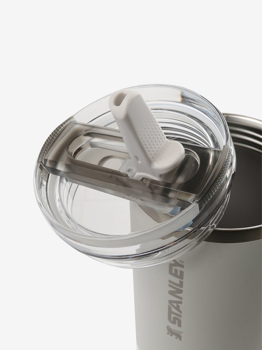 Close up of tan tumbler, showing texture of the lid and straw
