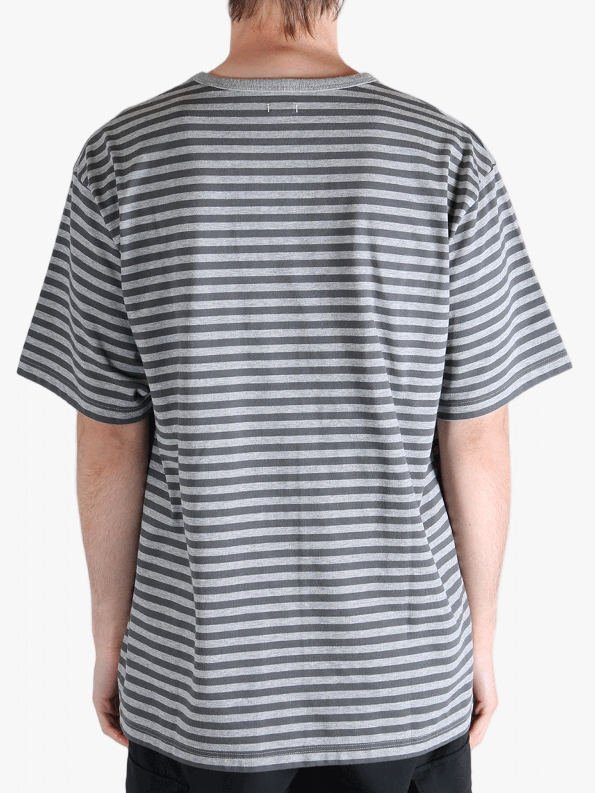 Grey t-shirt worn by a person, showing the t-shirt fit