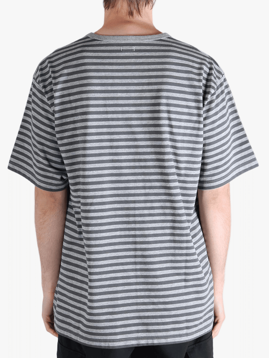 Grey t-shirt worn by a person, showing the t-shirt fit