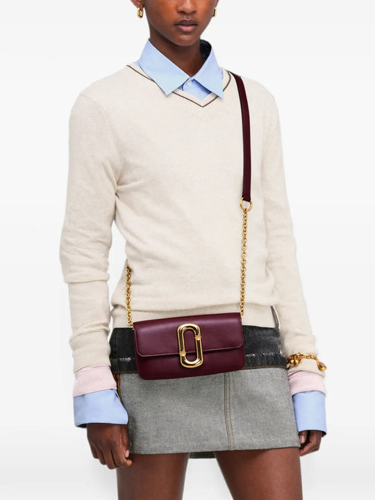 Burgundy accessories worn by a person, showing the accessories fit