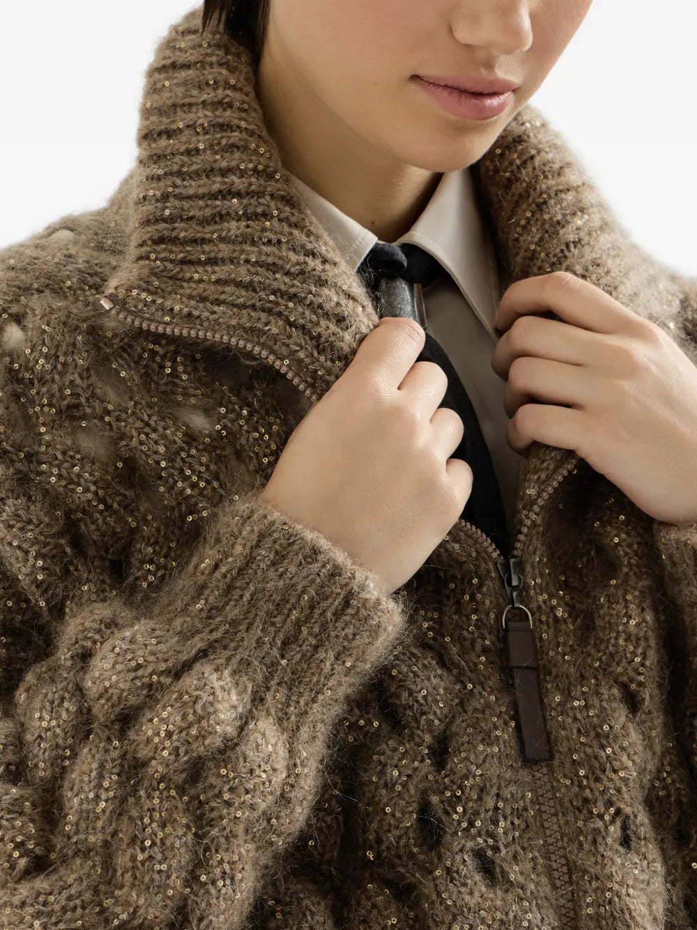 Brown knitwear worn by a person, showing the knitwear fit