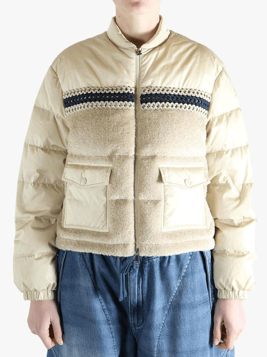 Tan jacket worn by a person, showing the jacket's fit