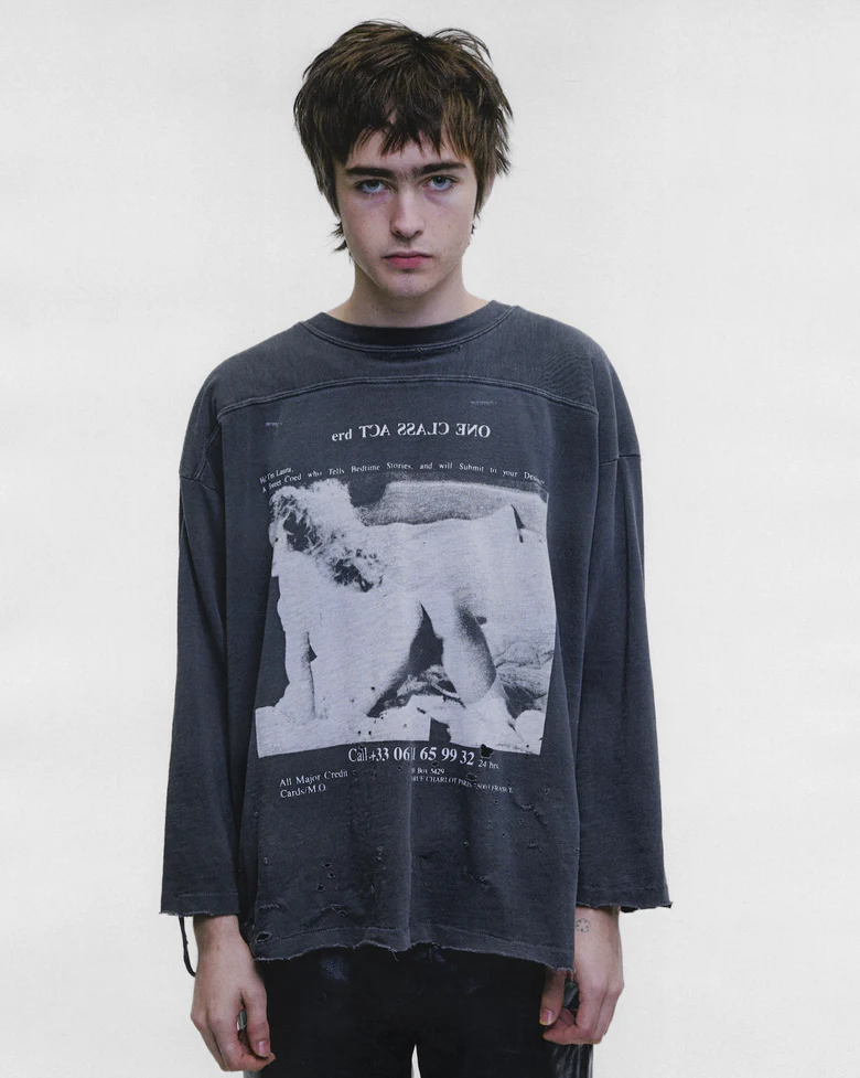Grey shirt worn by a person, showing the shirt fit